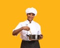 Beautiful Black Chef Woman With Spatula Stirring Food In Saucepan Royalty Free Stock Photo