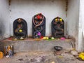 Beautiful black color stone snake statue decorated with flower during festival