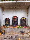 Beautiful black color stone snake statue decorated with flower during festival