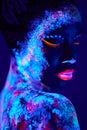 beautiful black fashion woman in neon UF light. attractive young model