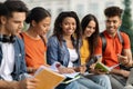 Beautiful Black Female Student Study Together Outdoors With Her Friends Royalty Free Stock Photo