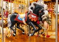 Beautiful black flying horse with traditional paintwork in a glittered vintage carousel