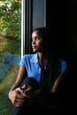 Beautiful black girl reflected in window