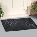 Beautiful Black Grey Sacred Pattern Rubber Glitter door mat with yellow flowers and leaves Royalty Free Stock Photo