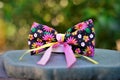 A beautiful black hair ribbon with colorful flowers and ribbons for junina party