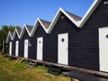 Beautiful black painted fishing huts cabins on the coast