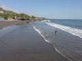 Beautiful black sand beach waves rolling in