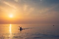 Beautiful Black sea sunrise in Odessa with silhouette of kayaking man and warm colors Royalty Free Stock Photo