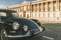 Beautiful black vintage car parked in front of the Louvre Museum, Paris, France Royalty Free Stock Photo