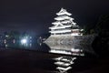 Beautiful black and white of Matsumoto castle with bright light at night