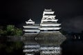 Beautiful black and white of Matsumoto castle with bright light at night