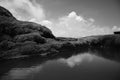 Beautiful black and white mountain ranges top view with a lake and sky covered with white clouds, Top of a trekking point,