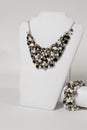 Beautiful black and white necklace with bracelet on a mannequin Royalty Free Stock Photo