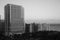 Beautiful black and white picture of the buildings alongside the ocean