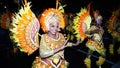 A beautiful black woman dressed in yellow costume with red accents with an Asian theme.