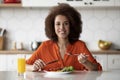 Beautiful Black Woman Eating Tasty Breakfast Or Lunch In Kitchen At Home Royalty Free Stock Photo