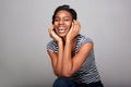 Beautiful black woman laughing with hands on face Royalty Free Stock Photo