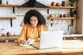 An african-american young woman is using laptop Royalty Free Stock Photo