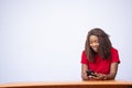 Beautiful black woman smiling and  looking at her phone Royalty Free Stock Photo