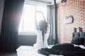 Beautiful black woman waking up in her bed, she is smiling and stretching Royalty Free Stock Photo