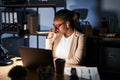 Beautiful black woman working at the office at night tired rubbing nose and eyes feeling fatigue and headache Royalty Free Stock Photo