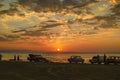 Beautiful blazing sunset landscape at Caspian sea and orange sky above it with awesome sun golden reflection on calm waves as a ba