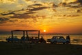 Beautiful blazing sunset landscape at Caspian sea and orange sky above it with awesome sun golden reflection on calm waves as a ba