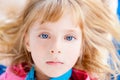 Beautiful blond blue eyes girl lying Royalty Free Stock Photo