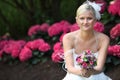 Beautiful blond bride holding bouquet Royalty Free Stock Photo