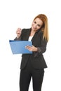 Beautiful blond businesswoman talking on mobile phone smiling writing notes on notepad folder Royalty Free Stock Photo