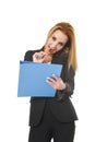 Beautiful blond businesswoman talking on mobile phone smiling writing notes on notepad folder Royalty Free Stock Photo