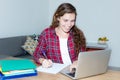 Beautiful blond female student working with computer Royalty Free Stock Photo