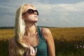 Beautiful blond girl on the field.beauty woman.sunglasses Royalty Free Stock Photo