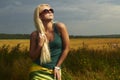 Beautiful blond girl on the field.beauty woman.sunglasses Royalty Free Stock Photo