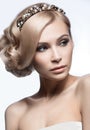 Beautiful blond girl in the image of a bride with a tiara in her hair. Beauty face. Wedding image. Royalty Free Stock Photo
