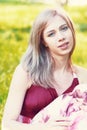 Beautiful blond girl on a park Royalty Free Stock Photo