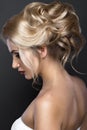 Beautiful blond girl with perfect skin, evening make-up, wedding hairstyle. Beauty face. Royalty Free Stock Photo