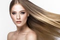 Beautiful blond girl with a perfectly smooth hair, and classic make-up. Beauty face. Royalty Free Stock Photo