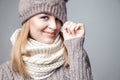 Beautiful blond girl wears winter scarf and hat Royalty Free Stock Photo