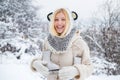 Beautiful blond hair girl i winter clothes outdoor. Funny young woman in the winter time. Beautiful pretty young woman Royalty Free Stock Photo