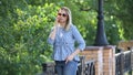 Beautiful blond in jeans talking on the phone