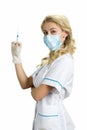 Beautiful blond nurse with syringe. Royalty Free Stock Photo
