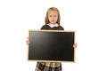 Beautiful blond schoolgirl sad moody and tired holding and showing small blank blackboard Royalty Free Stock Photo