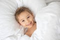 Beautiful blond toddler child, boy, sleeping in bed with teddy bear toy Royalty Free Stock Photo