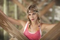 A beautiful blond woman with braids under pier in St.Augustine, Florida. Royalty Free Stock Photo