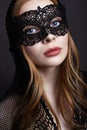 Beautiful Blond Woman in a Carnival Mask. Masquerade Royalty Free Stock Photo