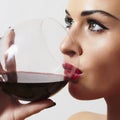 Beautiful blond woman drinking red wine.make-up.red lips Royalty Free Stock Photo