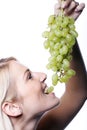 Beautiful blond woman eating green Royalty Free Stock Photo