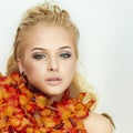 Beautiful blond woman enjoys a bath with flowers