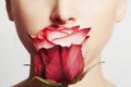 Beautiful blond woman face and flower.girl and rose.close-up portrait.skin care Royalty Free Stock Photo